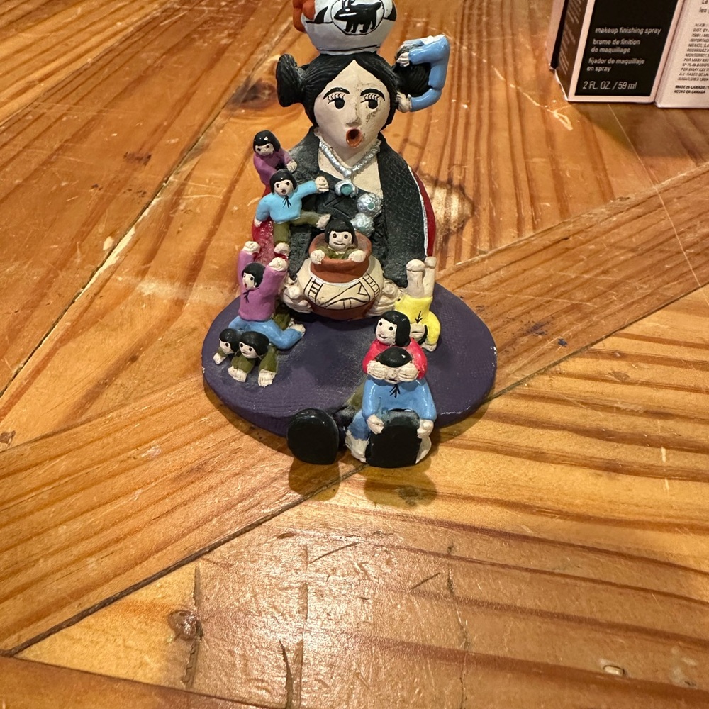 Whimsical Family Figurine with Black and Blue Details